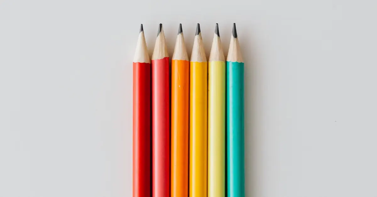 Colouring pencils standing in a jar on a white background
